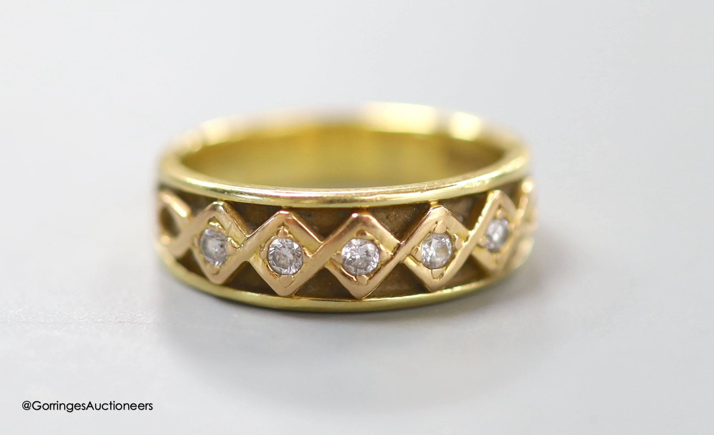 An 18ct gold five-stone diamond ring, gross 6.2g